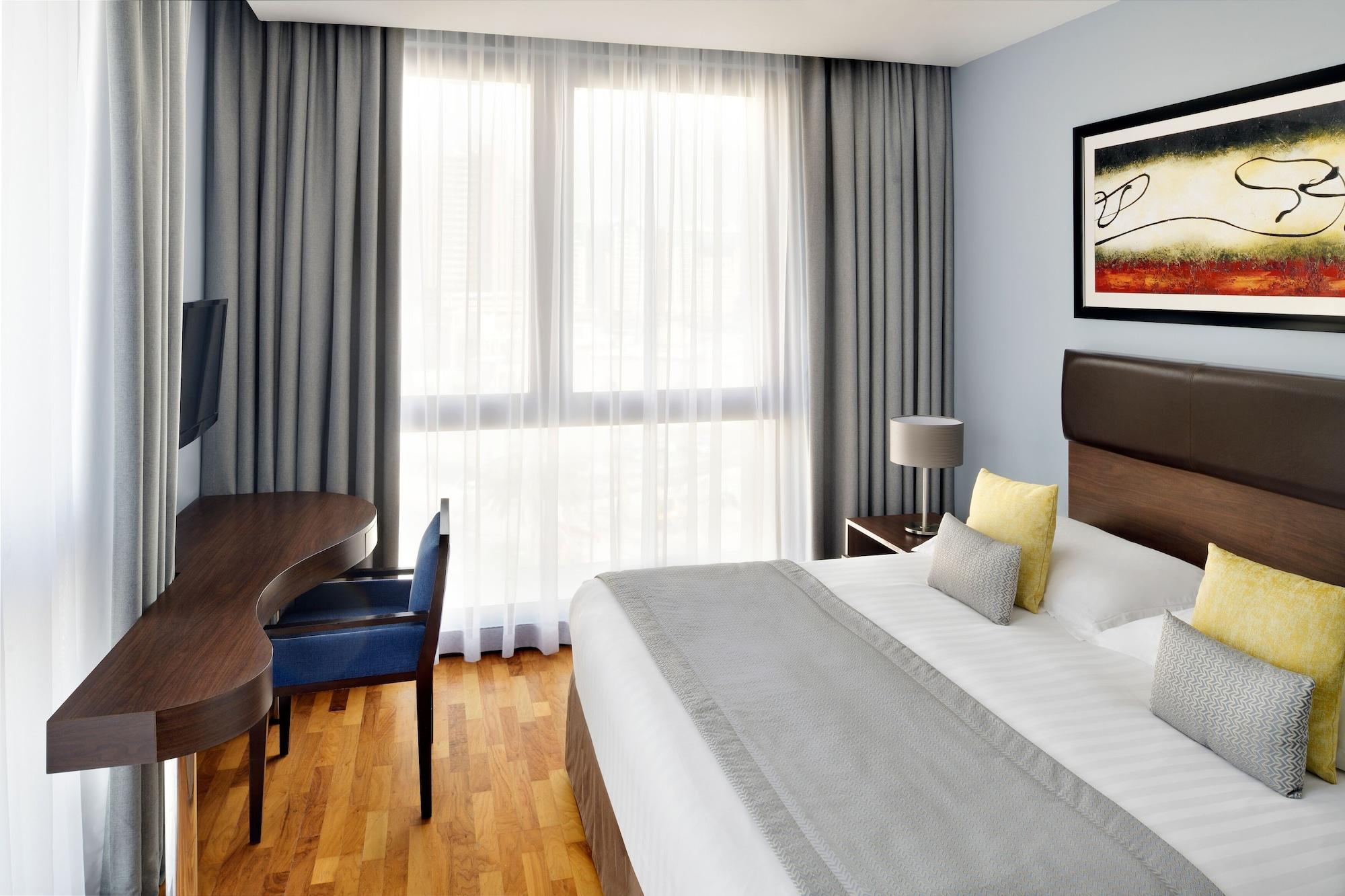 โมเวนพิคโฮเต็ล อพาร์ตเมนต์ อัล มัมซาร์ ดูไบ Aparthotel ภายนอก รูปภาพ A typical room at the hotel