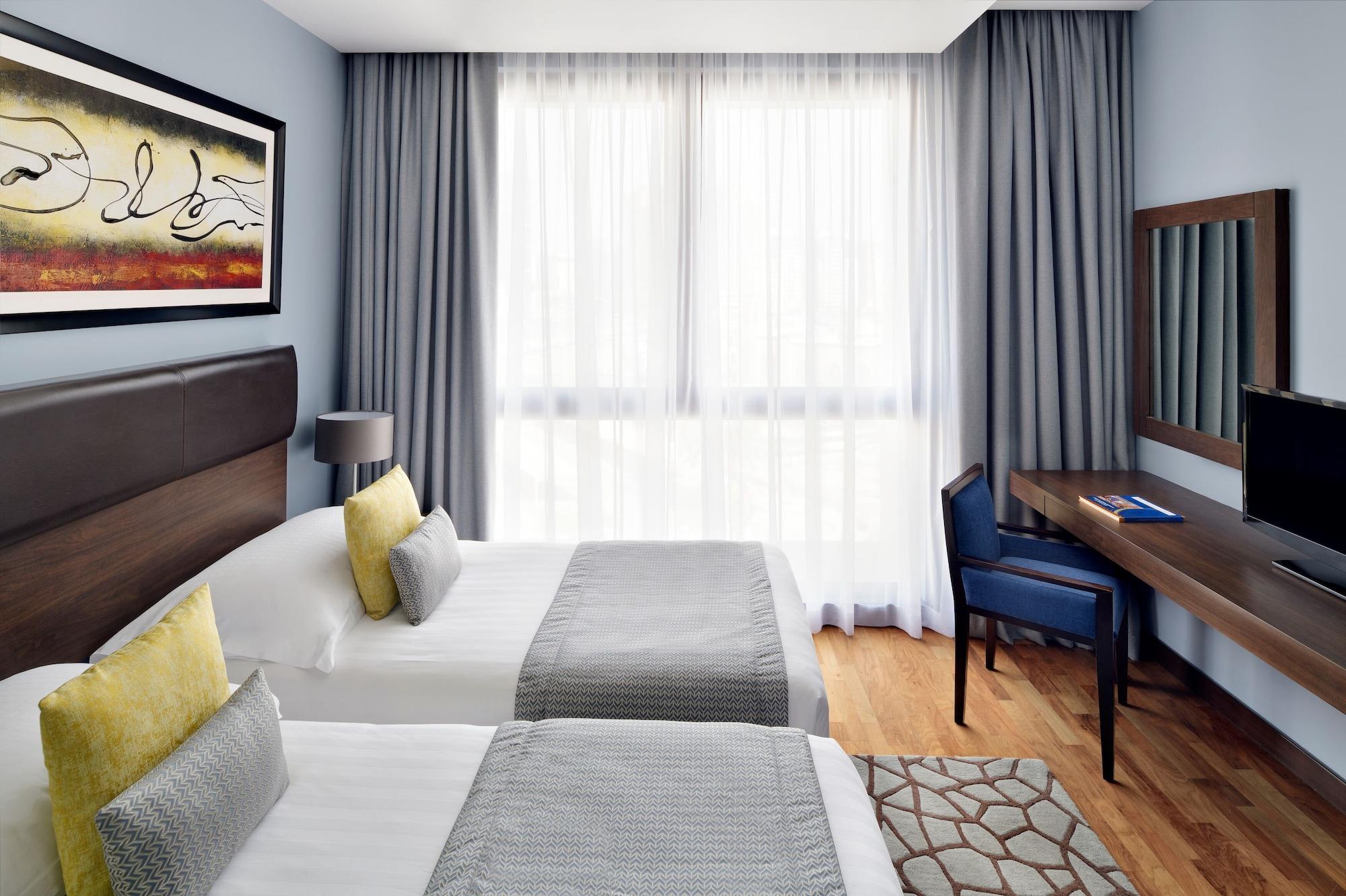โมเวนพิคโฮเต็ล อพาร์ตเมนต์ อัล มัมซาร์ ดูไบ Aparthotel ภายนอก รูปภาพ A room at the hotel
