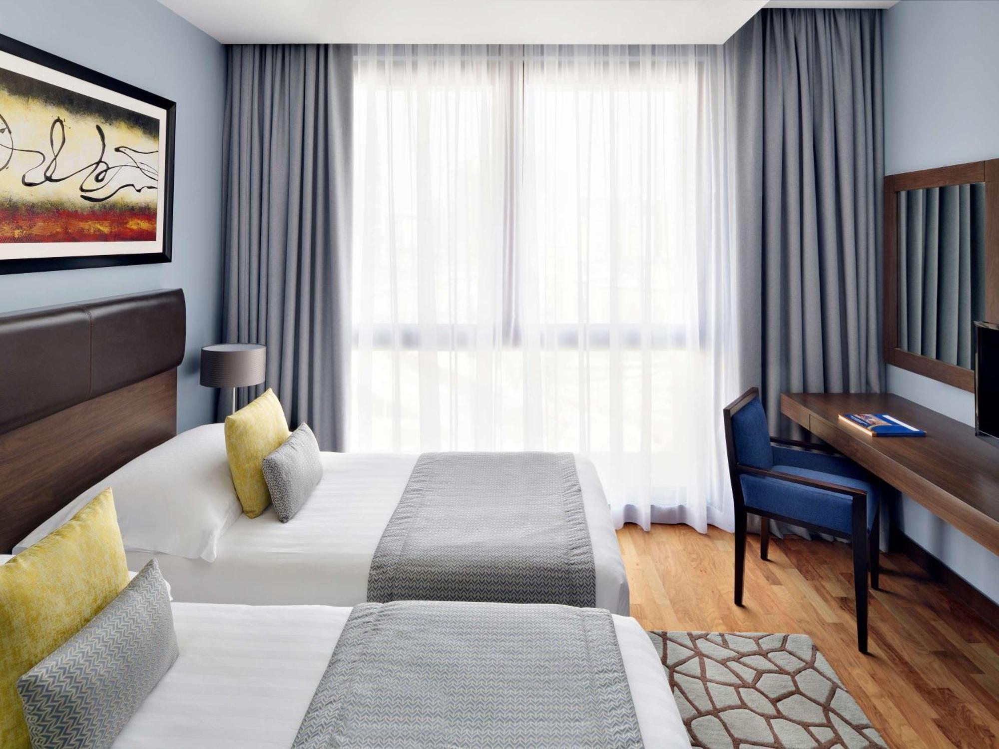 โมเวนพิคโฮเต็ล อพาร์ตเมนต์ อัล มัมซาร์ ดูไบ Aparthotel ภายนอก รูปภาพ A room at the hotel